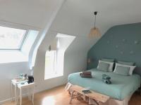 Łóżko lub łóżka w pokoju w obiekcie Home Emoi