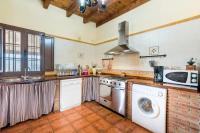 A kitchen or kitchenette at Panoramic View Villa Almogía