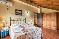 A bed or beds in a room at Panoramic View Villa Almogía