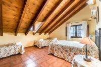 A bed or beds in a room at Panoramic View Villa Almogía