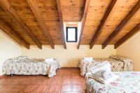 A bed or beds in a room at Panoramic View Villa Almogía
