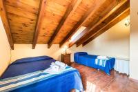 A bed or beds in a room at Panoramic View Villa Almogía