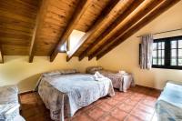 A bed or beds in a room at Panoramic View Villa Almogía