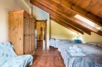A bed or beds in a room at Panoramic View Villa Almogía
