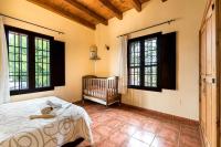 A bed or beds in a room at Panoramic View Villa Almogía