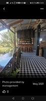 a picture of a room with a table and chairs at Bar Ang Guesthouse in Battambang