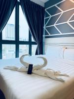 Ein Bett oder Betten in einem Zimmer der Unterkunft XING LUN KLCC The Colony Infinitum