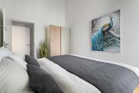 Postel nebo postele na pokoji v ubytování Ocean Sunset- Penthouse, Balkon, Kamin