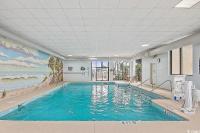 Der Swimmingpool an oder in der Nähe von Coastal Comfort Your Perfect Beachfront Getaway