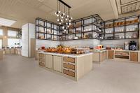 a large kitchen with a large island in a room at Courtyard by Marriott Phuket, Patong Beach Resort in Patong Beach