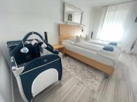 Posteľ alebo postele v izbe v ubytovaní Alpesi Apartman Downtown