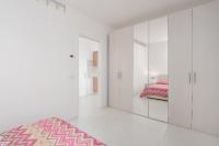 A bed or beds in a room at Cormorani - Appartamento 13
