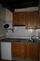 Kuchyň nebo kuchyňský kout v ubytování Apartamentos Rurales El Palacio de Doiras