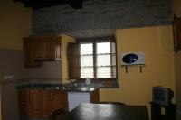 Kuchyň nebo kuchyňský kout v ubytování Apartamentos Rurales El Palacio de Doiras