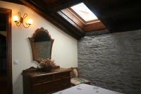 Postel nebo postele na pokoji v ubytování Apartamentos Rurales El Palacio de Doiras