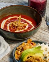 a bowl of soup and a plate of food on a table at Hotel Casa Vertiz in Oaxaca City