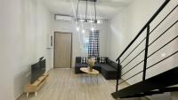Televízia a/alebo spoločenská miestnosť v ubytovaní SKG Loft