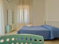Postel nebo postele na pokoji v ubytování Appartamento Villa Circe