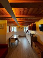 Televízia a/alebo spoločenská miestnosť v ubytovaní Maison Palmira