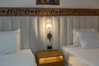 Postel nebo postele na pokoji v ubytování Superior Pyramids Inn