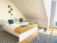 Posteľ alebo postele v izbe v ubytovaní Alpesi Apartman Downtown