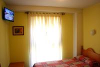 Postel nebo postele na pokoji v ubytování Hostal La Granja