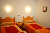 Postel nebo postele na pokoji v ubytování Hostal La Granja