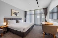 Clarion Apartments South Melbourneにあるベッド