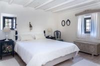 A bed or beds in a room at Authentic Cretan Stone Windmill