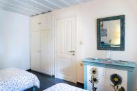 A bed or beds in a room at Authentic Cretan Stone Windmill