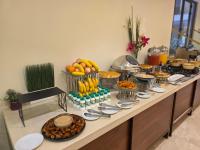 a buffet with food and fruit on a table at فندق جولدن إيليت - Golden Elite Hotel in Al Khobar