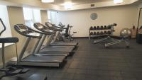 a gym with treadmills and exercise equipment in a room at The Gainsborough Bath Spa - Small Luxury Hotels of the World in Bath