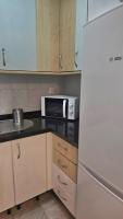 A kitchen or kitchenette at Ideal Holiday Apartment City Center