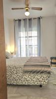 A bed or beds in a room at Ideal Holiday Apartment City Center