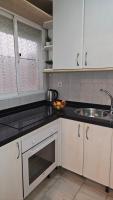 A kitchen or kitchenette at Ideal Holiday Apartment City Center