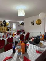 a room with tables with soda bottles and balloons at ANK -HOME i PRESIDENT- NIK in Telcişor