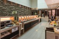 a restaurant with a buffet line with food on display at Taipung Suites in Anping