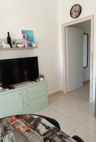 Televízia a/alebo spoločenská miestnosť v ubytovaní Apartment Marijan - Rtina