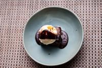a chocolate dessert on a plate on a table at ibis Tangará Da Serra in Tangara da Serra