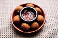 a bowl of food with a dipping sauce in it at ibis Tangará Da Serra in Tangara da Serra