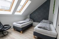 Postel nebo postele na pokoji v ubytování Jókai Apartman
