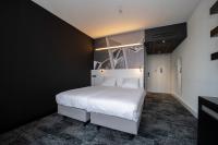 Ein Bett oder Betten in einem Zimmer der Unterkunft Fletcher Wellness-Hotel Helmond