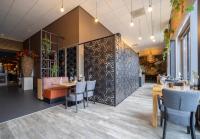 Ein Restaurant oder anderes Speiselokal in der Unterkunft Fletcher Wellness-Hotel Helmond 