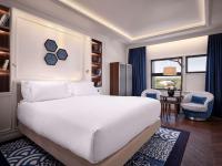 A bed or beds in a room at Sofitel Barcelona Skipper