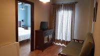Televízia a/alebo spoločenská miestnosť v ubytovaní Hotel Tharsis