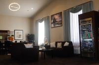 a living room with couches and a drink cooler at Quality Inn Airport in Colorado Springs
