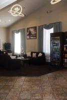 a living room with a couch and a drink cooler at Quality Inn Airport in Colorado Springs