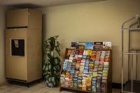 a room with a refrigerator next to a wall at Quality Inn Airport in Colorado Springs