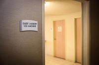 a sign on the wall of a room with a door at Quality Inn Airport in Colorado Springs