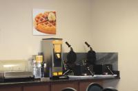 a counter with a coffee maker and a microwave at Quality Inn Airport in Colorado Springs